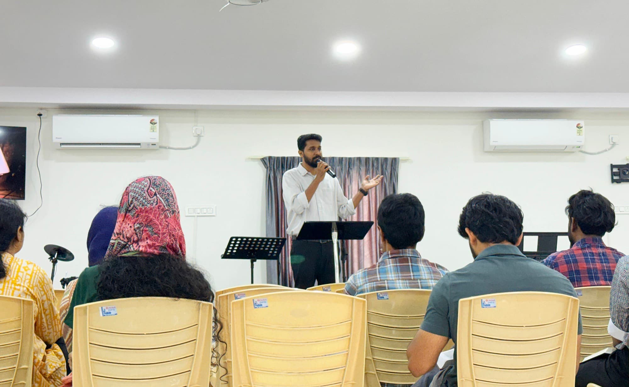 Pastor Sam Philip preaching from the book of Acts at New Life Fellowship Church, HSR Layout
