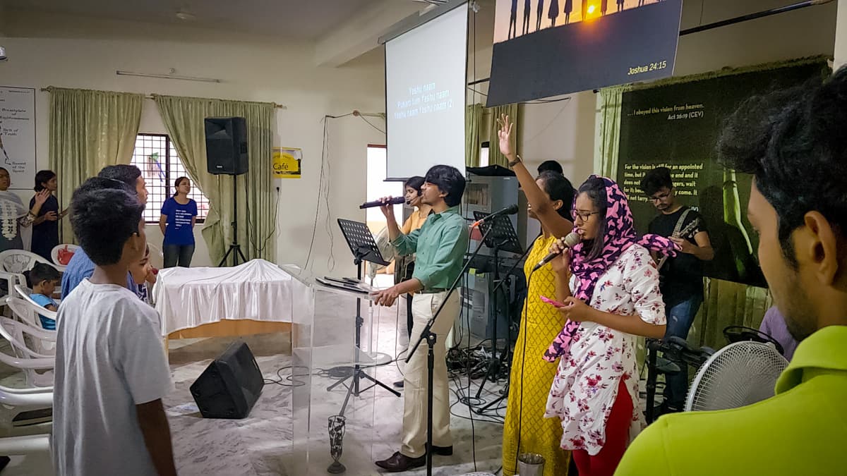 A member of the New Life Fellowship HSR Layout congregation sharing a testimony