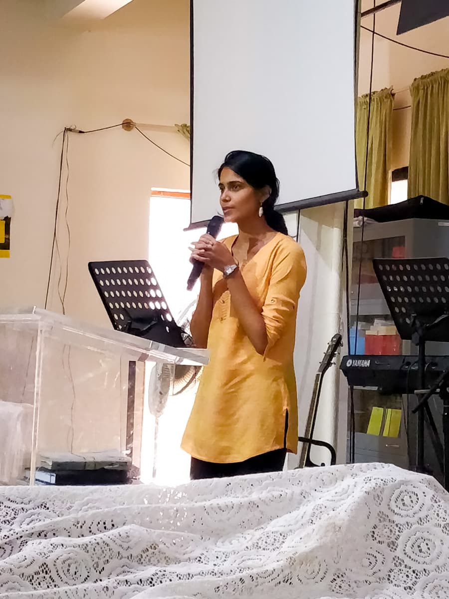A member of the New Life Fellowship HSR Layout congregation sharing a testimony