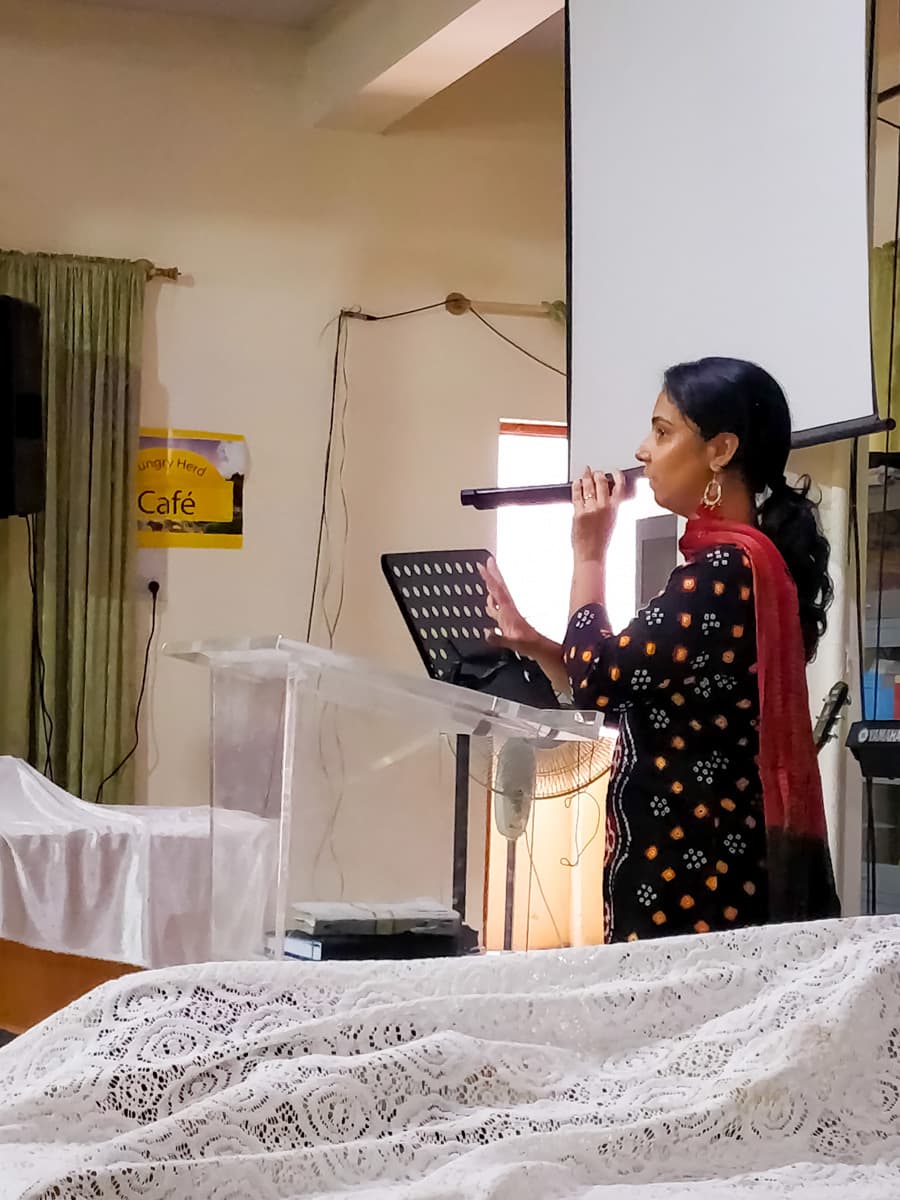 A member of the New Life Fellowship HSR Layout congregation sharing a testimony