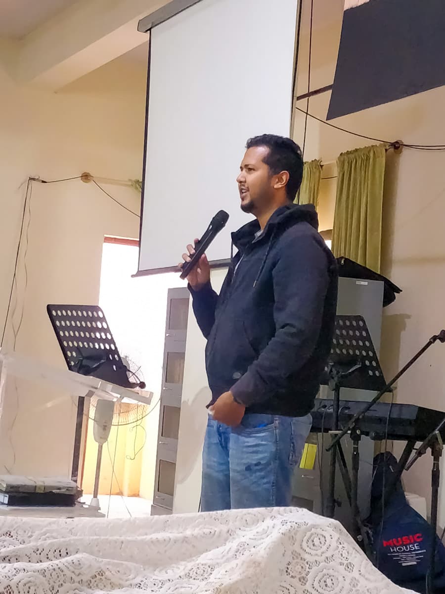 A member of the New Life Fellowship HSR Layout congregation sharing a testimony