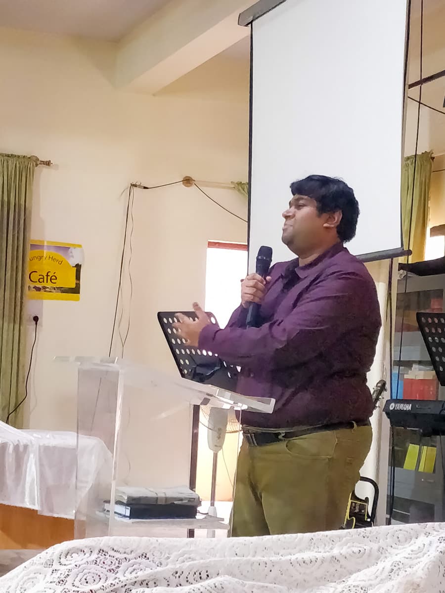 A member of the New Life Fellowship HSR Layout congregation sharing a testimony